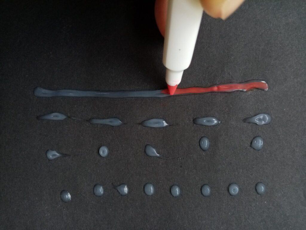 A permanent marker is used to highlight the glue in a colour contrasting with the background